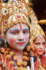 Children enact Krishna and Radha during a shobha yatra taken out by the Ram Mandir Sabha in Shimla