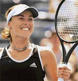 Switzerlands Martina Hingis rejoices after defeating Frances Pauline Parmentier during the second round of the US Open in Flushing Meadows, New York, on Thursday. 