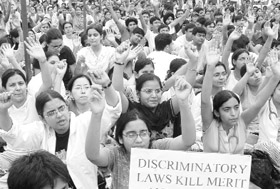 Caste-based quotas have become a galloping epidemic tearing apart the fabric of Indian society. A Tribune photo