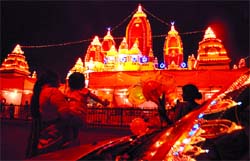 ALL DECKED OUT: Lights add to the splendour of Birla Mandir on the eve of Janmashtami in the Capital on Monday.