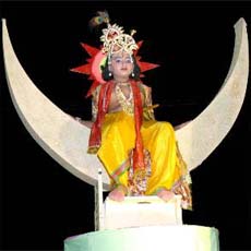 A child dressed as Lord Krishna to celebrate Janamashtami at Karnal