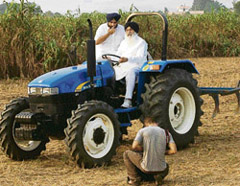 Chief Minister Parkash Singh Badal and his son Sukhbir Singh Badal pose for a photo for a national magazine cover at Mullapur Garibdass village in Mohali district