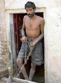 A mentally challenged person chained in his house in Amritsar.— Photo by Rajiv Sharma