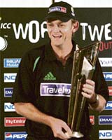 Australias vice-captain Adam Gilchrist holds the ICC Twenty20 World Cup trophy after a press conference in Johannesburg
