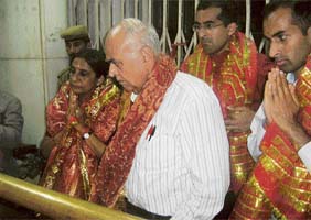 Justice Shri Ram of Malaysias Court of Appeals, his wife Chandra and sons Govind and Vinayak pay obeisance at the Bajjreshwari temple in Kangra on Tuesday evening