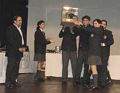 The winners with the inter-school biz quiz trophy.