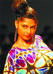 A model displays a creation during the Wills India Fashion Week in the Capital on Friday. 