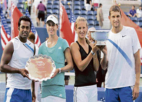 Leander Paes (left) and Meghann Shaughnessy (second from left) hold the runners-up trophy, while Victoria Azarenka and Max Mirnyi (right) pose with the winners trophy after the mixed doubles final at the US Open in New York on Thursday. Azarenka and Mirnyi won 6-4, 7-6. 