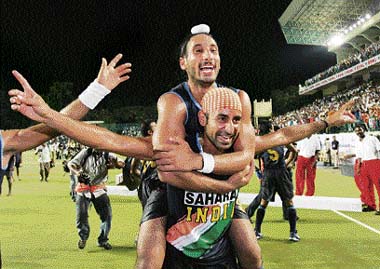 Prabhjot Singh (hands outstretched) celebrates with teammate Sardara Singh after Indias win over Korea in the final at the seventh Asia Cup Hockey tournament in Chennai on Sunday. India defeated Korea 7-2