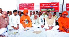 Social activists led by Swami Agnivesh, Kuldip Nayyar, Swami Ariyavesh and others stage a dharna against repeated disruption of Parliament, near the Parliament House in the Capital on Monday.
