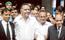 Former transport minister G.S. Bali (third from left) comes out of the courtroom after recording his statement before the Garg committee in Dharamsala