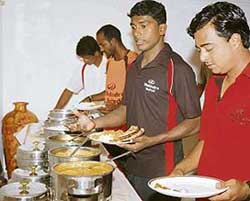 WHAT’S COOKING? Players participating in the Federation Cup have lunch at a hotel in Ludhiana on Tuesday.
