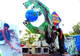 Greenpeace activists display an installation made from hazardous e-waste during a protest in the Capital on Wednesday. Greenpeace urged the electronics community and the Ministry of Information Technology to address the problem of hazardous substances in electronic products by bringing changes at the design level and by making sure that India has appropriate legislation to spur this move.