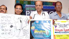 Dr. K.K.Aggarwal, president Heart Care Foundation of India ,along with Hasya Kavi Ashok Chakradhar(Left) and actor Virender Saxena (Right) during a press conference to promote the forthcoming MTNL Perfect Health Mela in the Capital on Wednesday. 