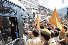 VHP members stop local buses near the Victory tunnel at Shimla on Wednesday to protest the proposed dismantling of Ram Setu