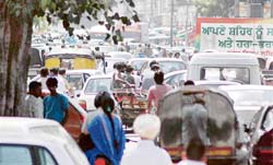 Vehicles parked haphazardly outside Khalsa College, Ghumar Mandi, in Ludhiana