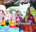 A woman artist gives final touches to Ganesha idols on the eve of Ganesh Chaturthy in Shahibabad (Uttar Pradesh) on Thursday.