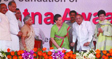 UPA chairperson Sonia Gandhi lays the foundation stone of low-cost houses for the poor