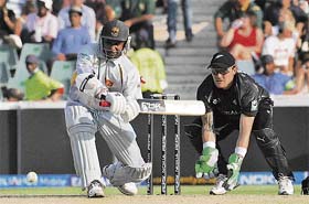 Sri Lankas Sanath Jayasuriya plays a shot as New Zealands wicketkeeper Brendon McCullum looks on during the Twenty20 World Cup match in Johannesburg