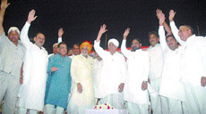 In a mahapanchayat of 360 villages, the Sangharsh Samiti leaders Sajjan Kumar, Chaudhary Meer Singh and others at Talkatora Stadium in the Capital on Sunday.Tribune photo