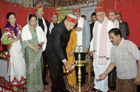 Chief Minister Virbhadra Singh lights the lamp to mark the Kullu People Association foundation day at Shimla on Sunday.