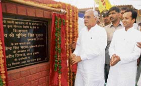 Haryana Chief Minister Bhupinder Singh Hooda lays the foundation stone of a gaushala at Pehowa