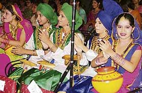 Participants of Master Tara Singh Memorial College wait for their turn to perform Malwai Gidha at ‘Khushamdeed-2007’ held in Ludhiana on Saturday night.