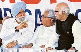 Former DGP of the Punjab Police K.P.S. Gill explains a point as Lok Sabha Opposition leader Lal Krishan Advani (extreme right) is all ears in Jalandhar