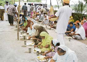 Sangat enjoy a langar at the Dashmesh Garden Colony gurdwara