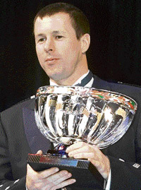 File picture dated December 14, 2001 shows Colin McRae holding his 2001 FIA World Rally Championship's trophy for second place in Monaco. 