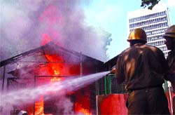 Firefighters douse the flame in an electric transformer near Janpath Bhawan Parking in the Capital 