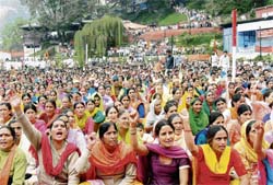 Hundreds of BMS members participate in a mazdoor mahapanchayat held at the Shimla skating rink ground on Monday.