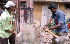 A Tribune file photo of MCD employees demolishing illegal construction at Patel Nagar in the Capital.