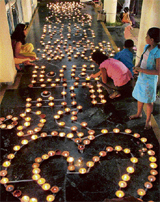 Members of the Marathi community light 1,001 deepaks at a Ganesh utsav function at DLF City, Gurgaon, on Monday night.