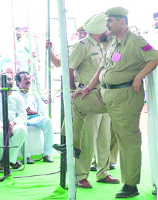A khaki heavyweight stands guard at a passage during a function in Jalandhar.