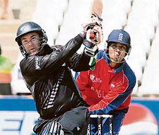 Craig McMillan hits a six as Englands wicketkeeper Vikram Solanki (right) looks on in ICC World Twenty20 Cricket match on Tuesday at the Kingsmead Cricket Stadium in Durban.
