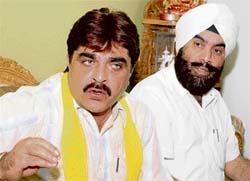 Rakesh Kamboj (left), Congress MLA, addresses a press conference in Karnal