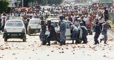 Nepalese policemen provide security to taxis after scuffles between student sand taxi drivers turned violent in Kathmandu