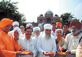 Kin of Bahadur Shah Zafar, Tantia Tope and Bhagat Singh lighting candles to observe the Anniversary of 1857 gadar at Humayon Tomb , in the Capital on Friday. Social activists Medha Patekar and Swamy Agnivesh are also present.