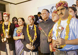 Governor V.S. Kokje with special children during a function organised to honour those selected to represent India in the Special Olympics World Summer Games-2007 to be held in Shanghai, China, at YMCA in Shimla on Friday.
