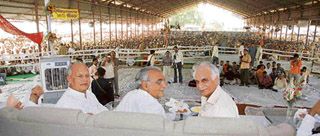 Haryana Chief Minister Bhupinder Singh Hooda (centre), Pradesh Congress Committee president Phool Chand Mullana (left) and party leader Harpal Singh at a public meeting at Tohana