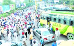 Traffic remained disrupted for more than an hour at PAP Chowk.The protesters were up in arms against heavy challaning