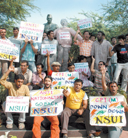NSUI actvists protest against the visit of CPM general secretary Prakash Karat to JNU for participating in a seminar on the Indo-US nuclear deal on Saturday.