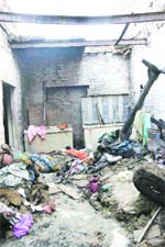 The roof of the house collapsed due to the blast. 