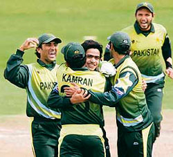Pakistans Fawad Alam (centre) celebrates the dismissal of New Zealands Lou Vincent with team mates (left to right) Younis Khan, Kamran Akmal, Shoaib Malik and Shahid Afridi during their ICC World Twenty20 semifinal match in Cape Town on Saturday.