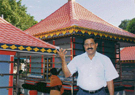 P. V. Sudhakaran in front of Sree Ayyappa temple 