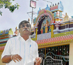 N. S. Radhakrishnan in front of Sri Murugan temple in Sector 31.