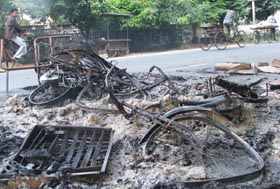 Remains of burnt vehicles outside the residence of the Vice-Chancellor of Aligarh Muslim University.  Reuters