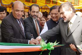 Indian and Afghan officials cut a ribbon during an opening ceremony in Kabul