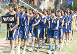 Mandi girls, who won the hockey championship in the state senior girls tournament, during a march past at Bilaspur
